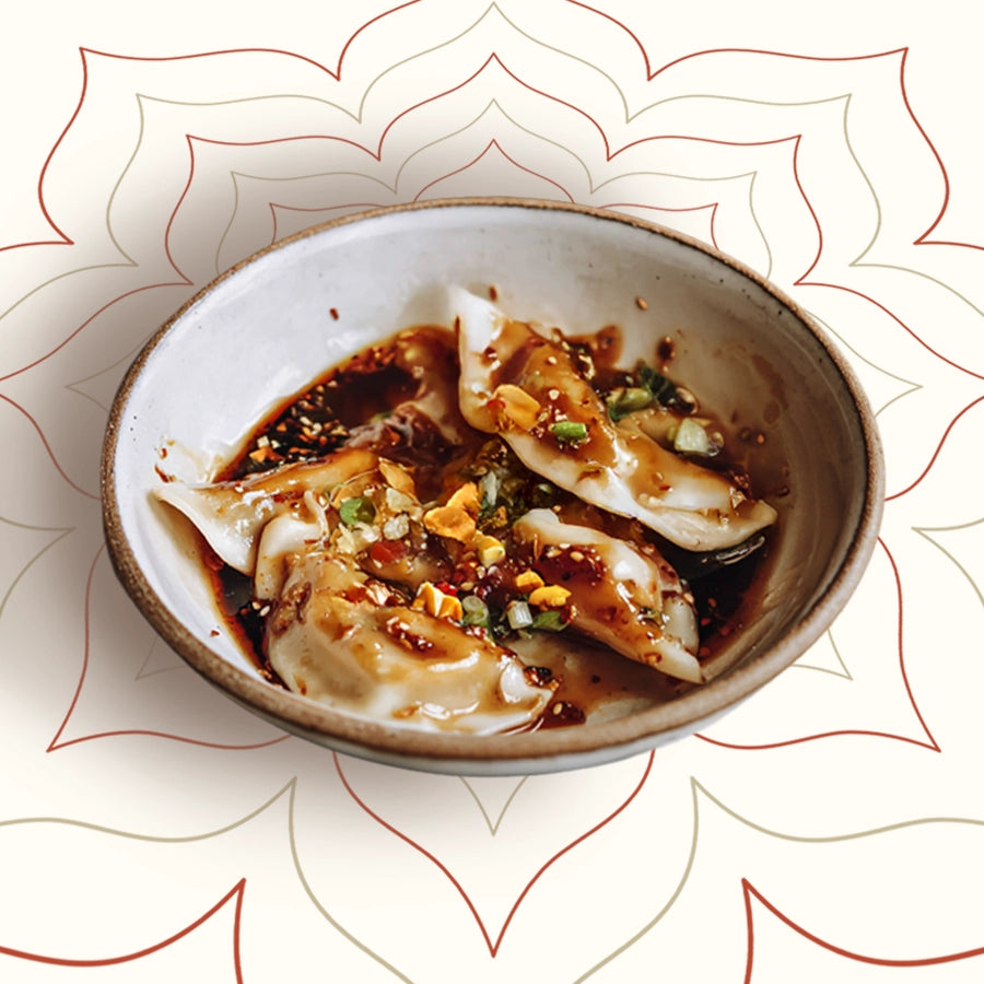 Try Sichuan Red Oil Dumplings at Wok Manifesto, Newcastle. Juicy handmade pork dumplings tossed in house-made crispy chilli oil and soy sauce, topped with peanuts, garlic and Sichuan spices – bold, fragrant and unmistakably Sichuan.
