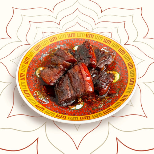 Braised pork belly slow-cooked in soy sauce and Shanxi aged vinegar – a festive Northern Chinese dish served with bao buns at Wok Manifesto Newcastle.