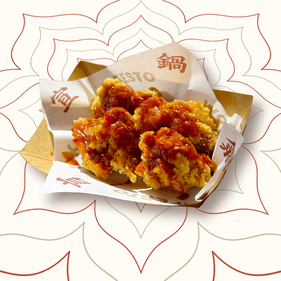 Crispy fried chicken coated in spicy Sichuan BBQ sauce with cumin, roasted chillies and fermented bean paste – bold Chinese street food at Wok Manifesto Newcastle.