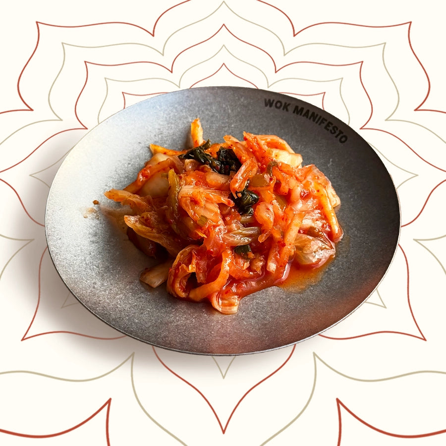 Kimchi made with Chinese leaf, radish and chilli – a bold, tangy Korean fermented side dish freshly served at Wok Manifesto Newcastle.
