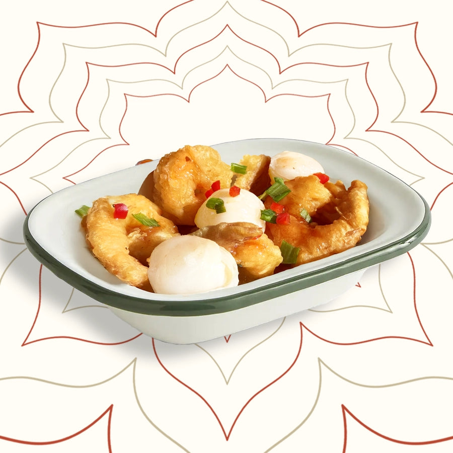 Crispy king prawns glazed in fruity lychee sauce with whole lychees – a refined Cantonese street food classic from Wok Manifesto Newcastle.
